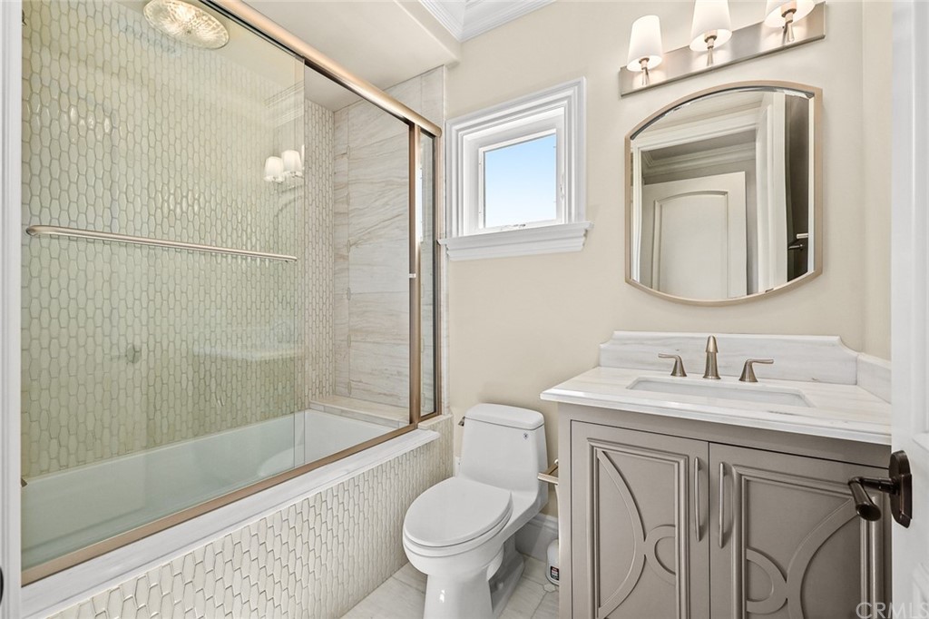 230 San Miguel Drive Arcadia, CA 91007 - Photo 43 of 57 a bathroom with a toilet sink and mirror