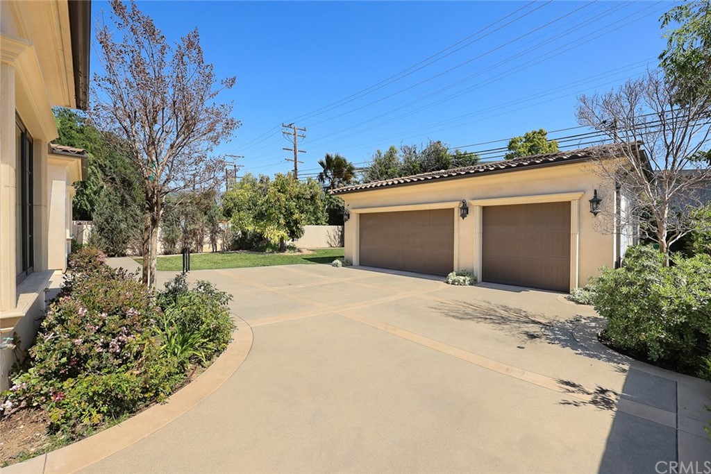 230 San Miguel Drive Arcadia, CA 91007 - Photo 50 of 57 a front view of a house with a yard and garage
