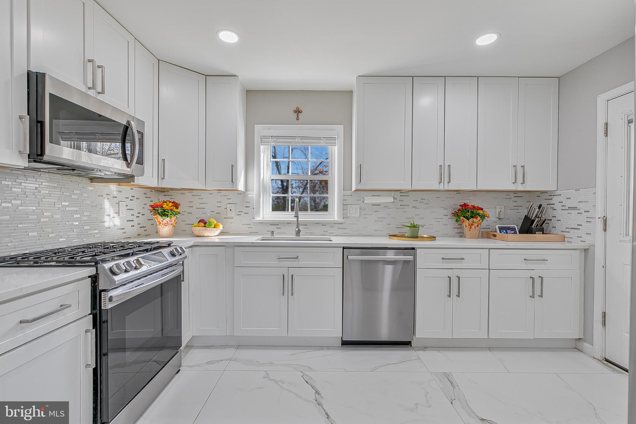 3419 Ramsgate Terrace Alexandria, VA 22309 - Photo 11 of 36 Bright and modern kitchen with sleek finishes.