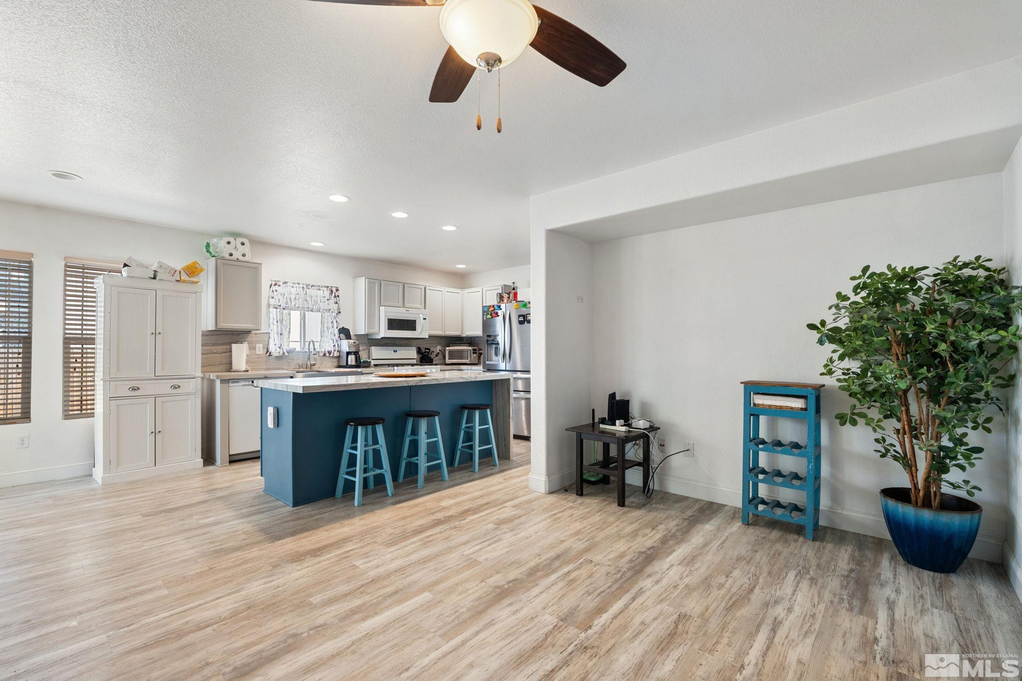 7721 Welsh Drive Reno, NV 89506 - Photo 10 of 27 a view of kitchen with sink microwave and refrigerator