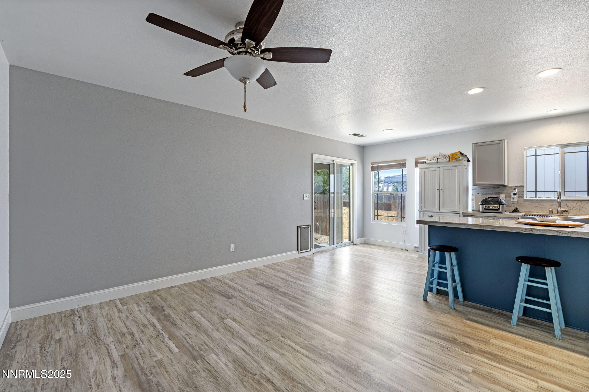 7721 Welsh Drive Reno, NV 89506 - Photo 11 of 27 a view of kitchen with furniture and wooden floor