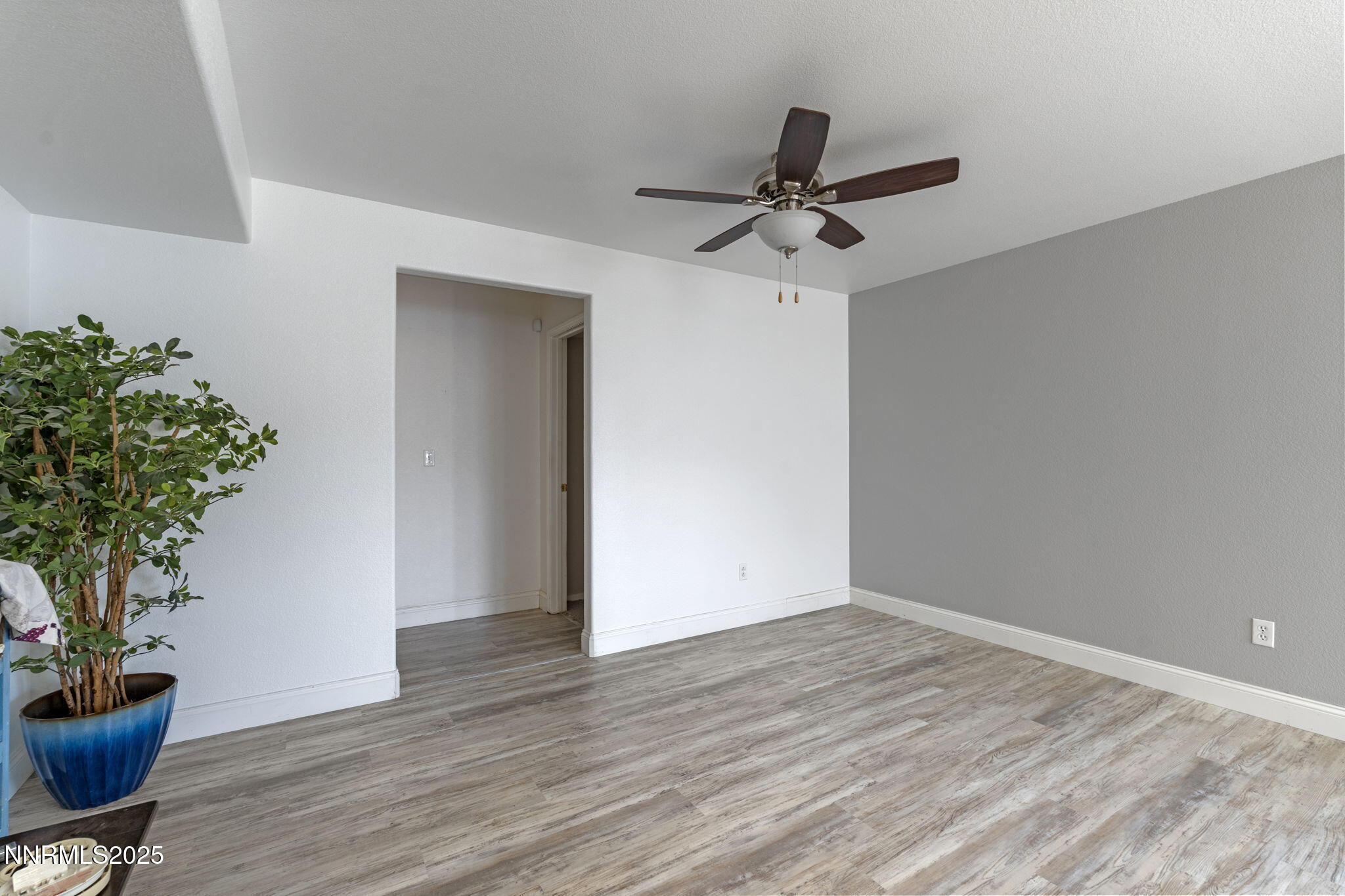 7721 Welsh Drive Reno, NV 89506 - Photo 12 of 27 a view of an empty room and wooden floor