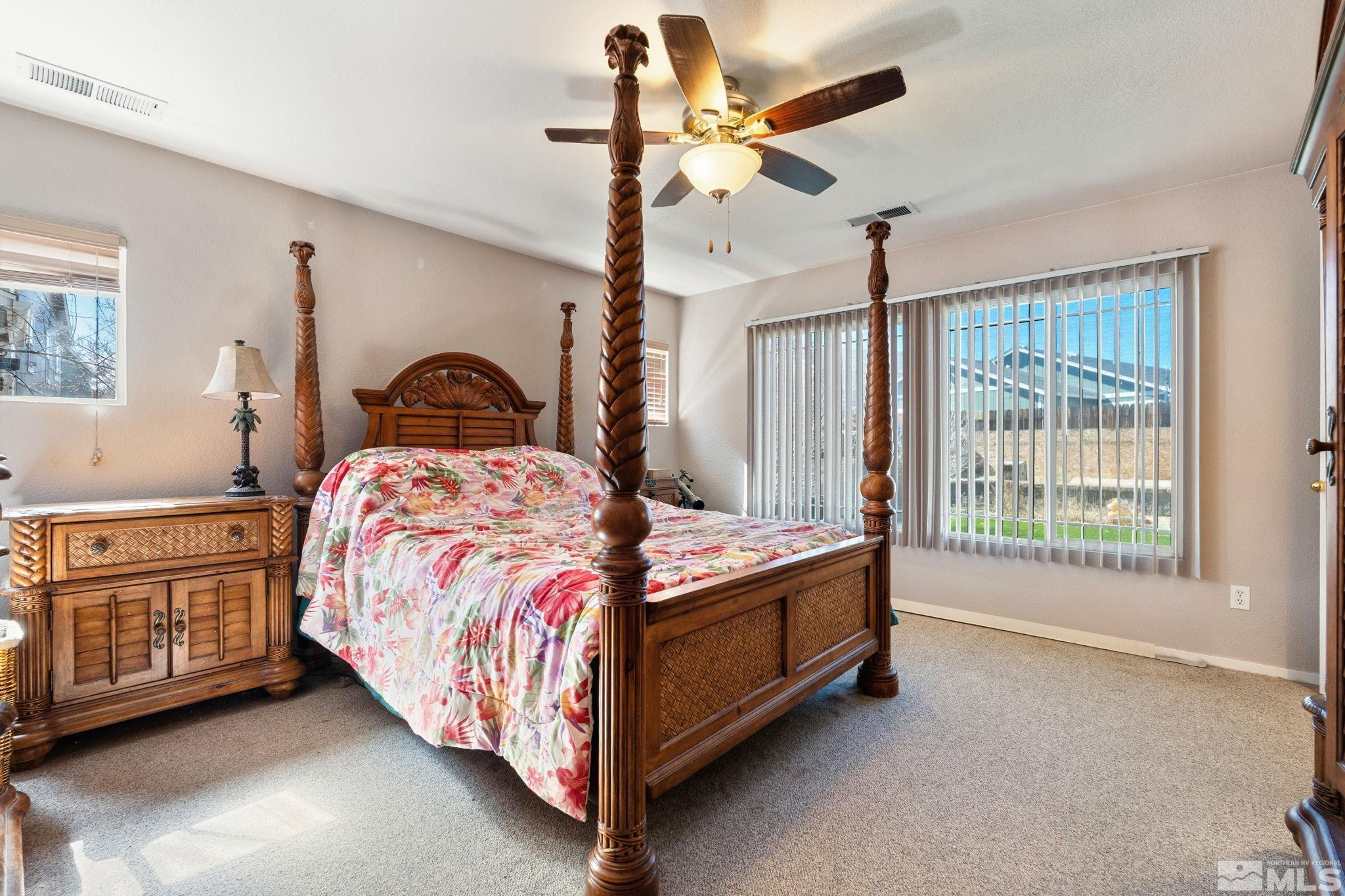 7721 Welsh Drive Reno, NV 89506 - Photo 15 of 27 a bedroom with a bed dresser and a window