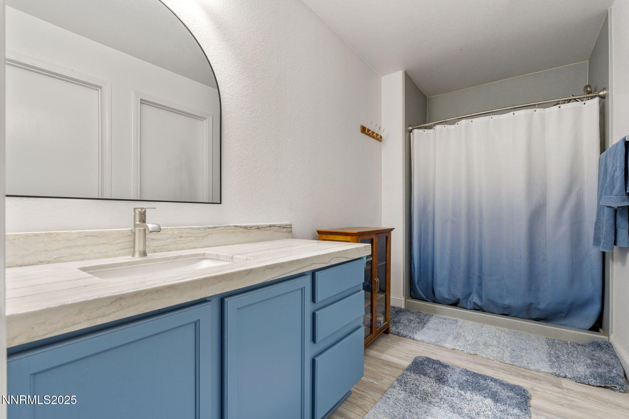 7721 Welsh Drive Reno, NV 89506 - Photo 17 of 27 a bathroom with a sink and a mirror