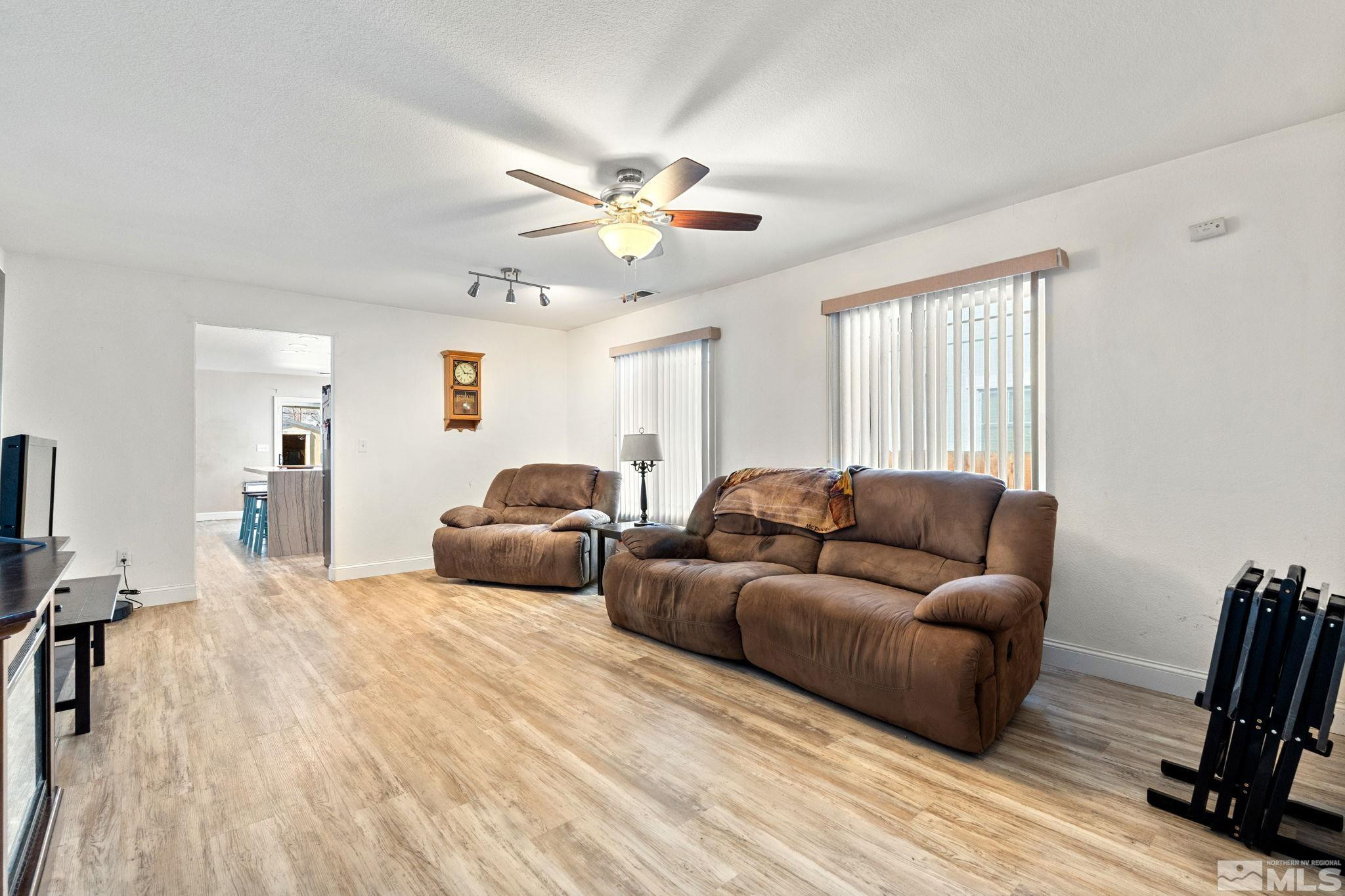 7721 Welsh Drive Reno, NV 89506 - Photo 4 of 27 a living room with furniture and a wooden floor