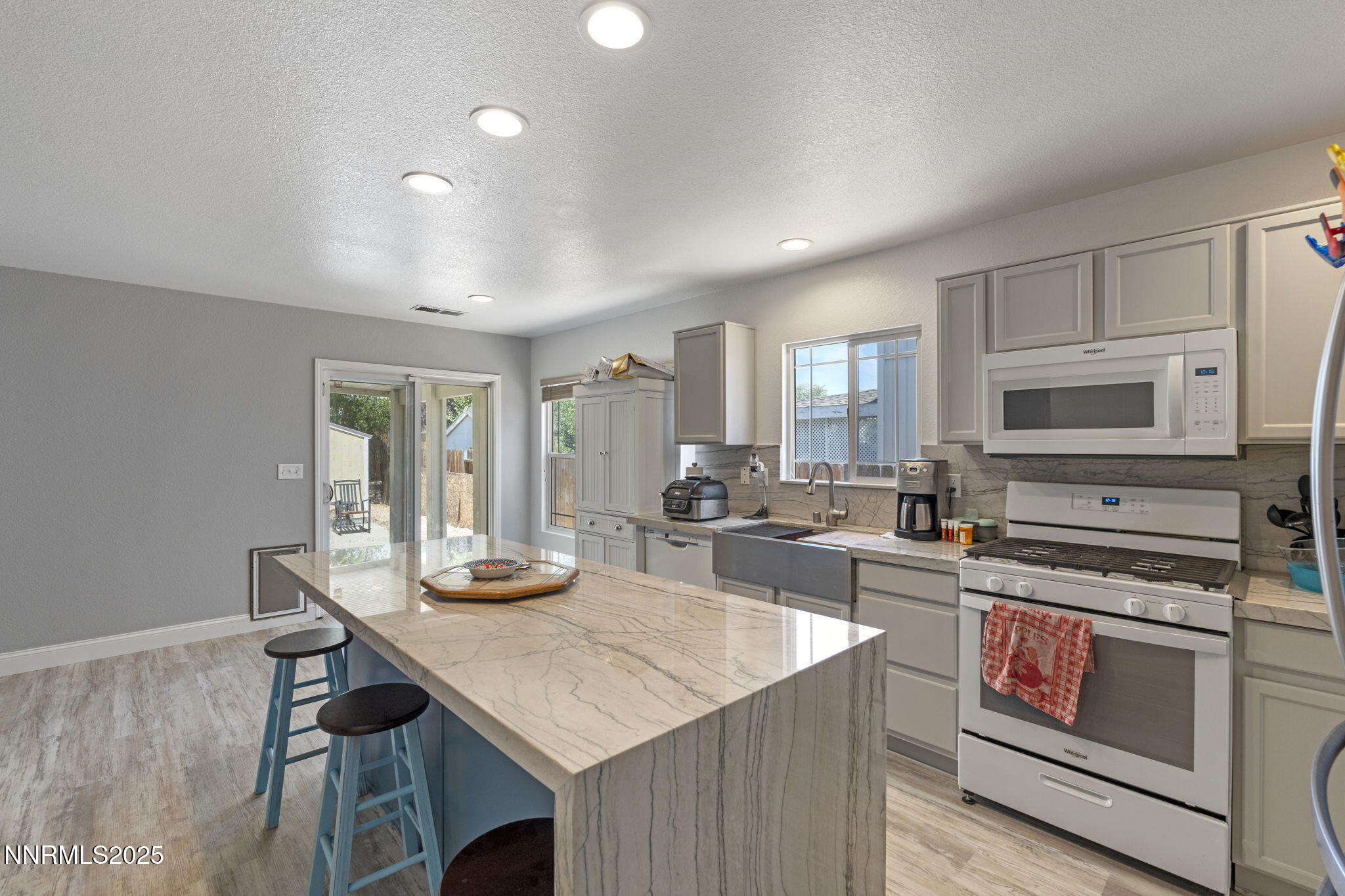 7721 Welsh Drive Reno, NV 89506 - Photo 5 of 27 a kitchen with a stove a sink and a refrigerator
