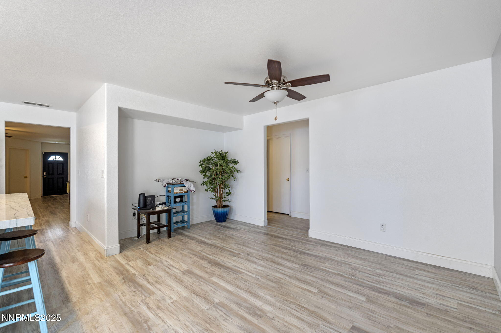 7721 Welsh Drive Reno, NV 89506 - Photo 9 of 27 a view of a room with wooden floor and furniture