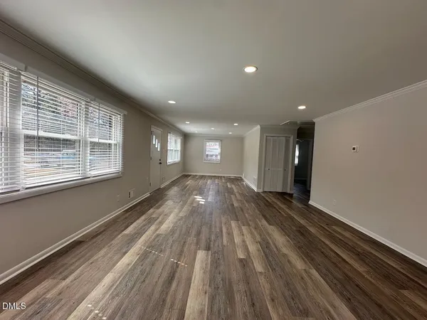 a view of hallway with wooden floor