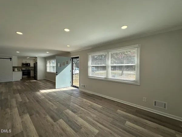 a view of an empty room with a window