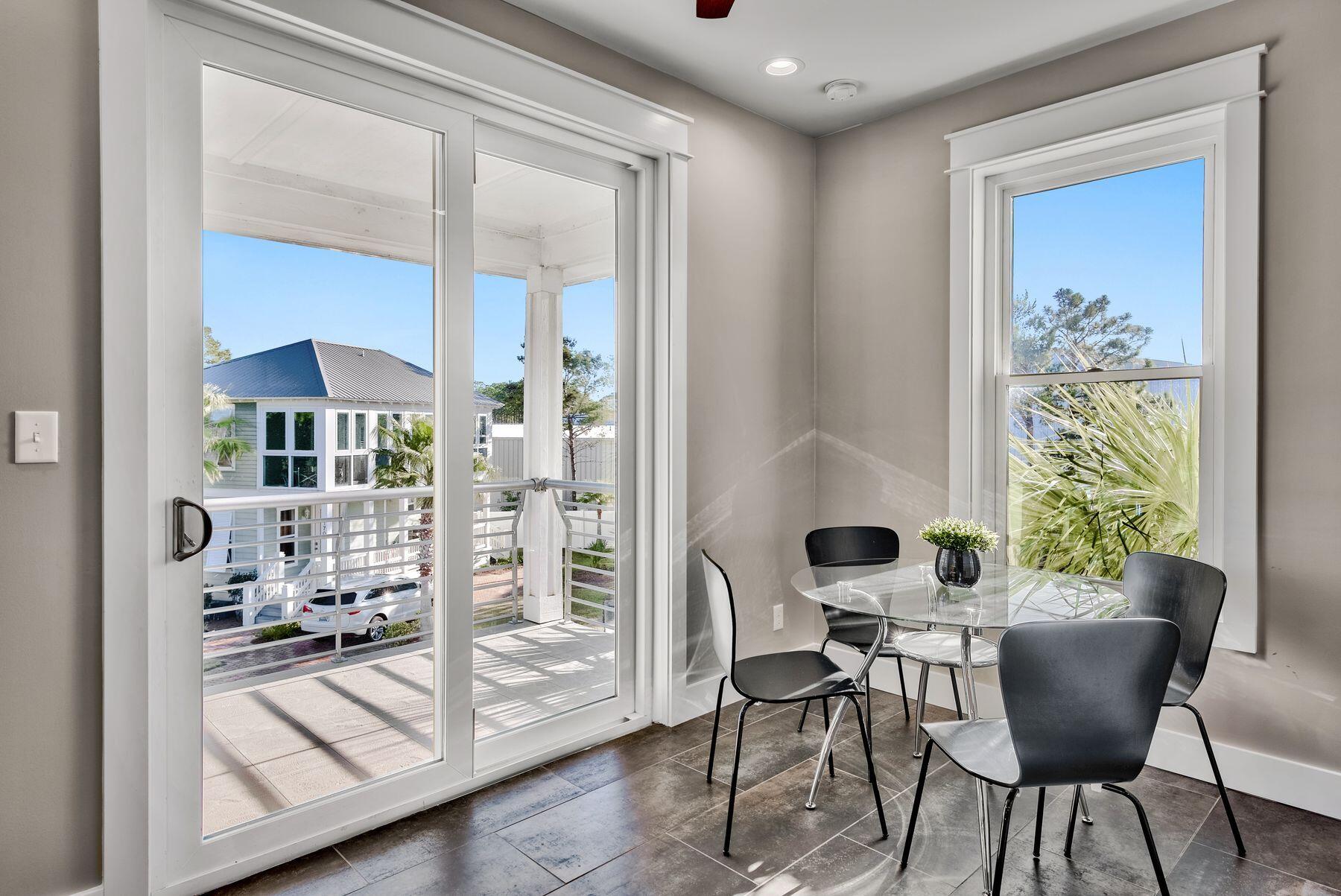 106 St Simon Circle Miramar Beach, FL 32550 - Photo 12 of 27 a view of a dining room with furniture and chandelier