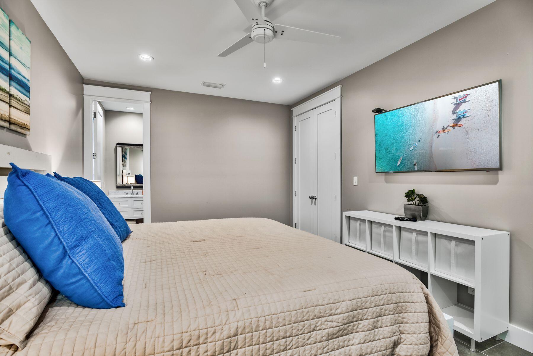 106 St Simon Circle Miramar Beach, FL 32550 - Photo 18 of 27 a bedroom with a large bed and a flat screen tv