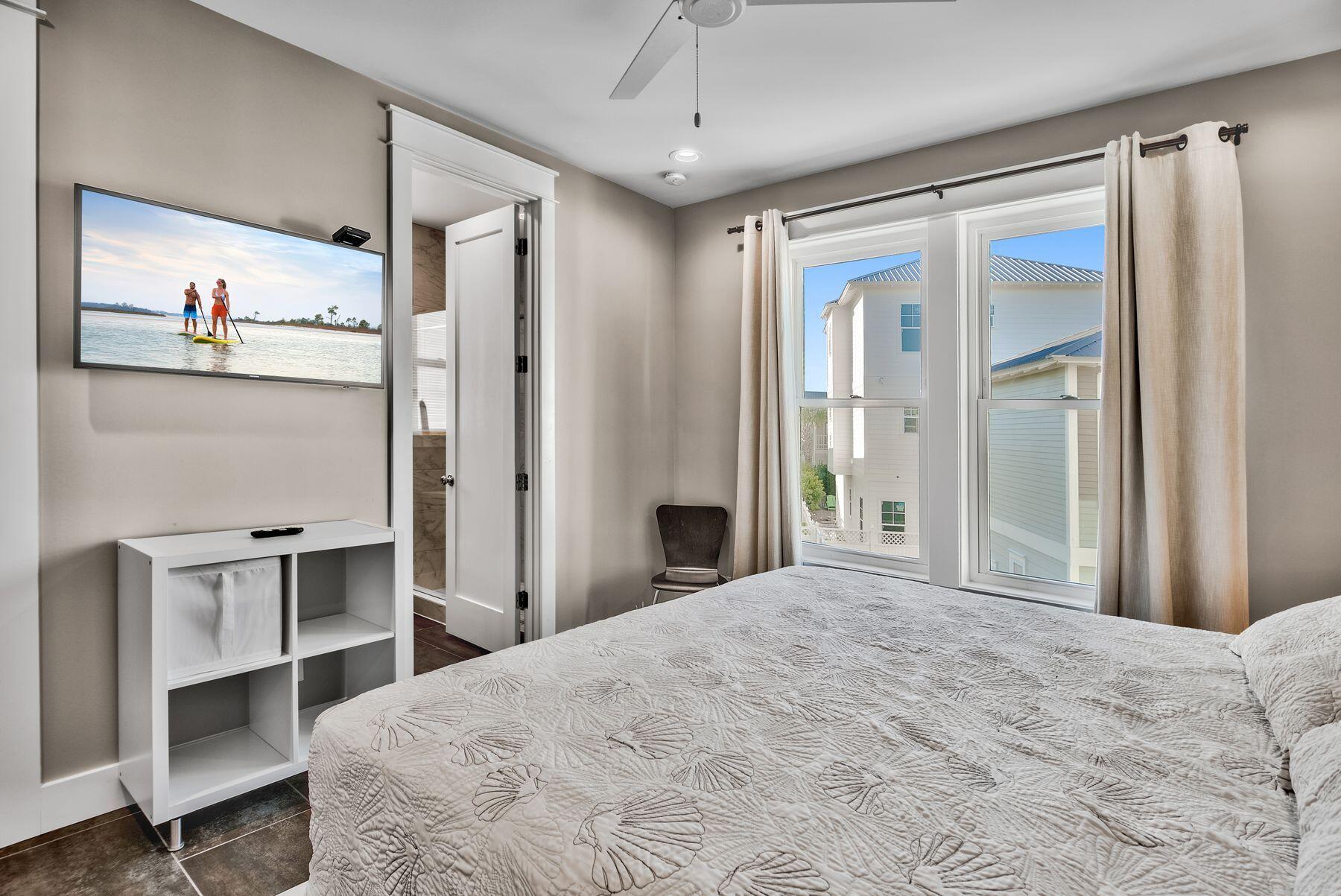 106 St Simon Circle Miramar Beach, FL 32550 - Photo 20 of 27 a bedroom with a bed and a desk