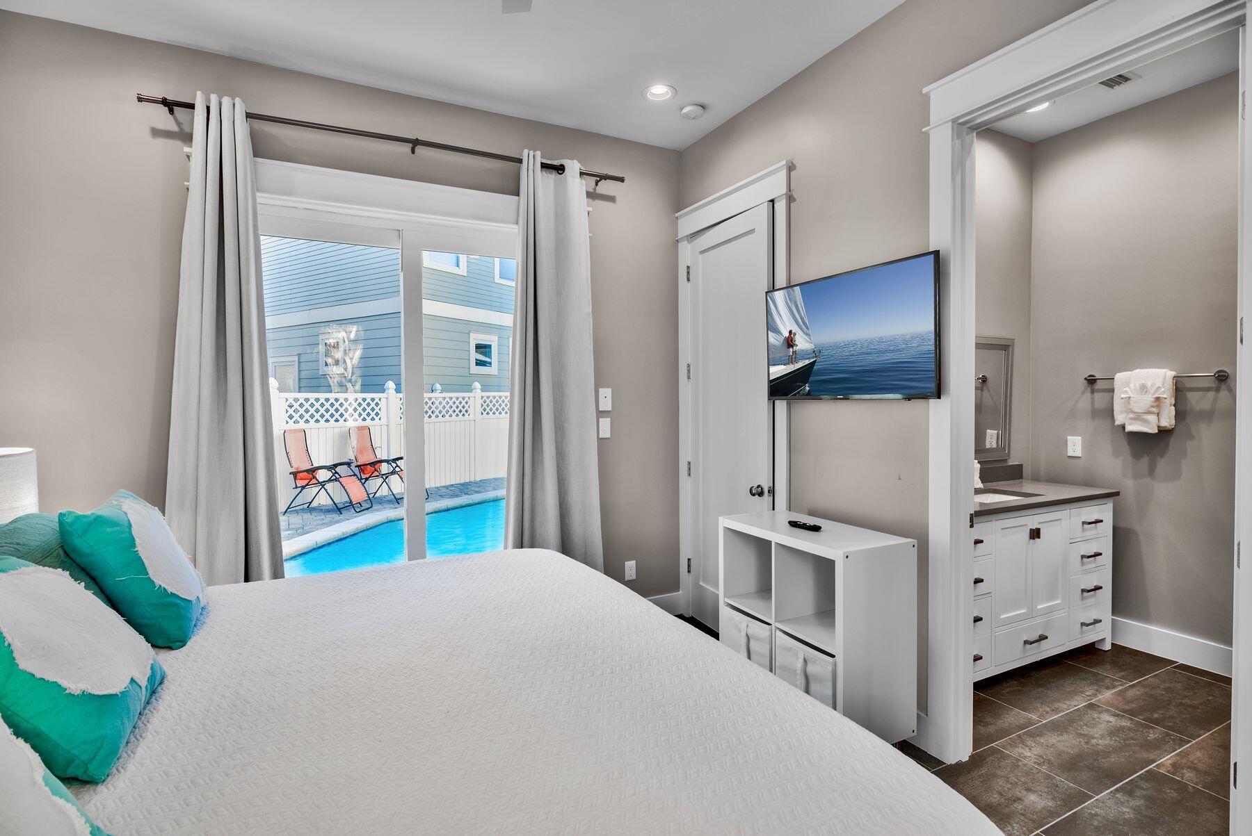 106 St Simon Circle Miramar Beach, FL 32550 - Photo 22 of 27 a bedroom with a bed and a dresser