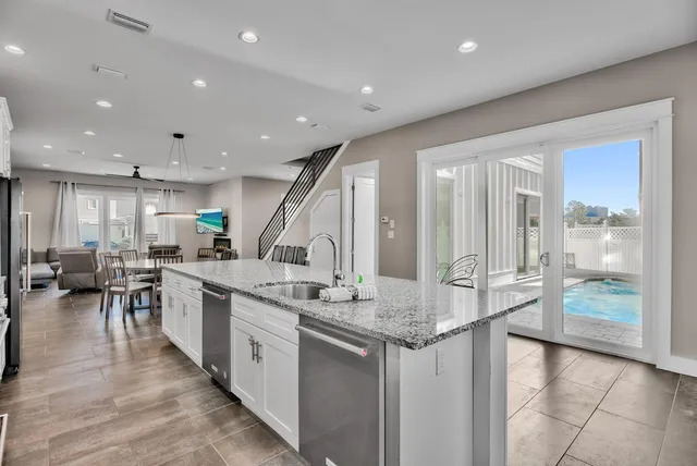 a large kitchen with a large counter top furniture and kitchen view
