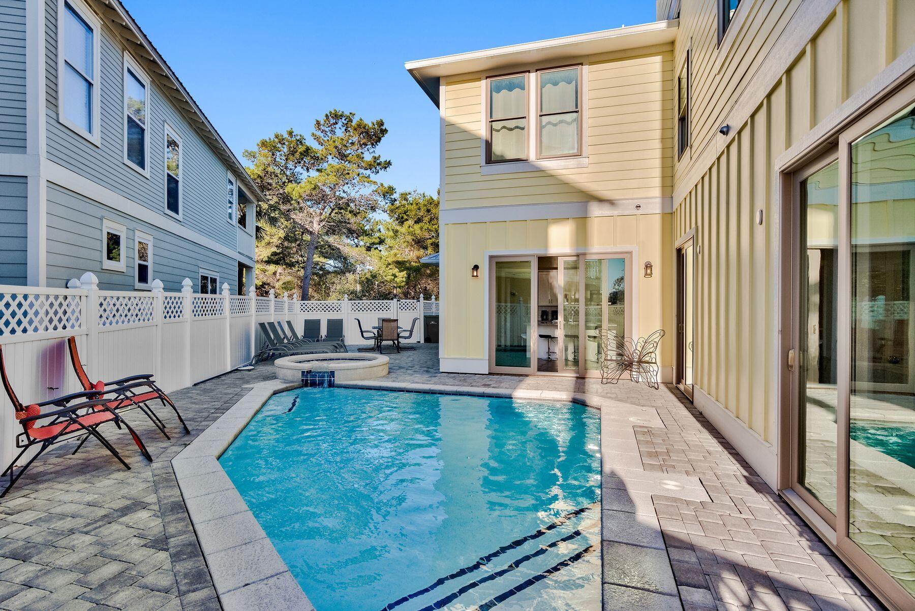 106 St Simon Circle Miramar Beach, FL 32550 - Photo 5 of 27 a view of a house with backyard and sitting area