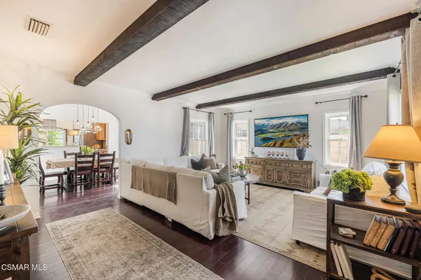 a living room with furniture and a table