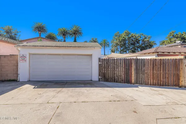 a front view of a house with a garage