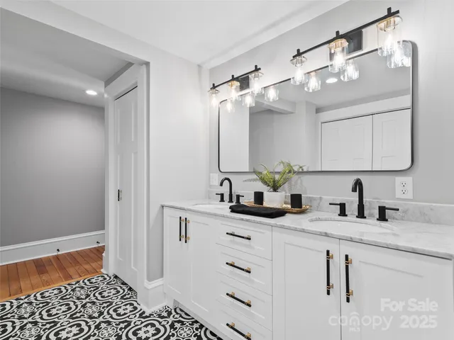 a bathroom with a sink a vanity and a mirror