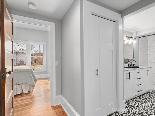a bathroom with a tub shower vanity and a sink