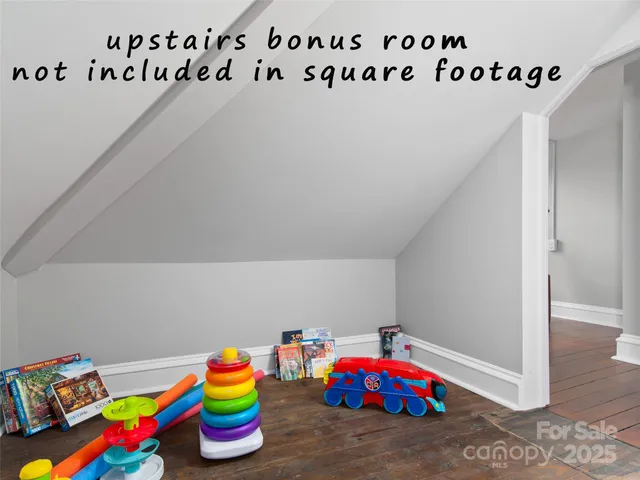 a room with toys and stairs