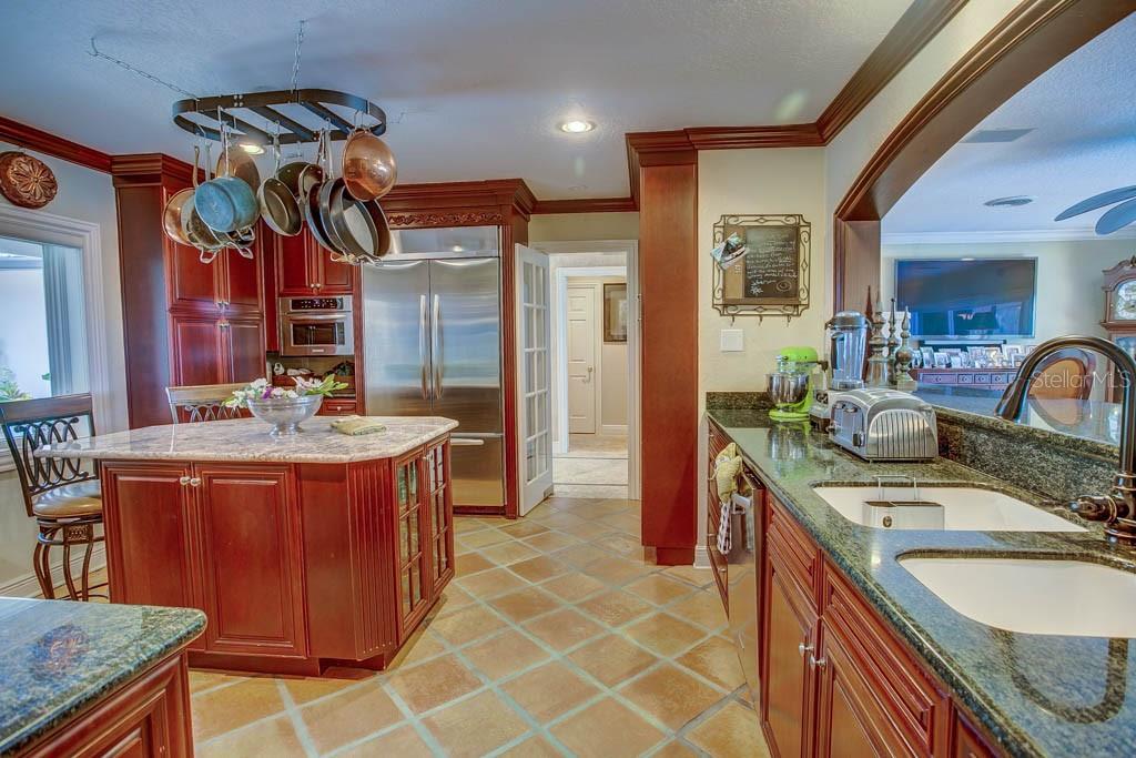 11002 Lake Butler Boulevard Windermere, FL 34786 - Photo 11 of 62 a dining hall with stainless steel appliances granite countertop a sink and a stove