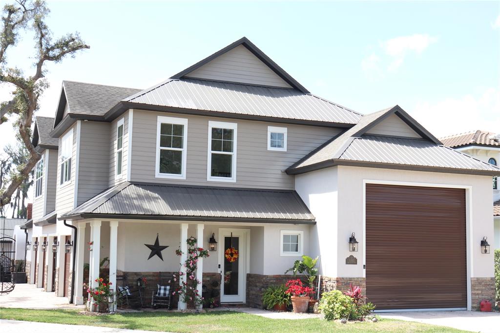 11002 Lake Butler Boulevard Windermere, FL 34786 - Photo 2 of 62 a front view of a house with garden