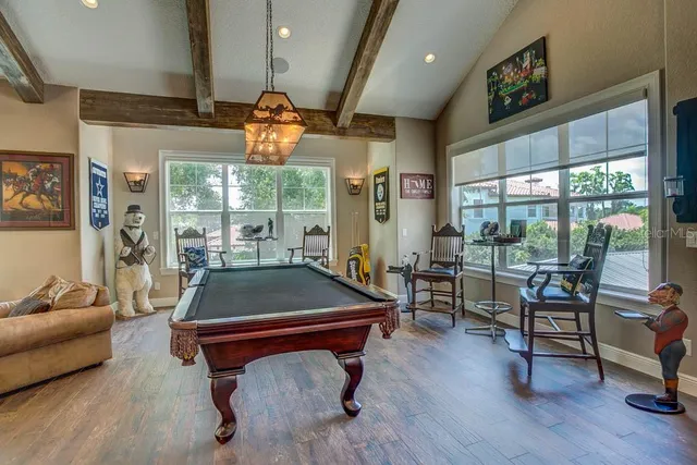 a living room with lots of furniture and kitchen