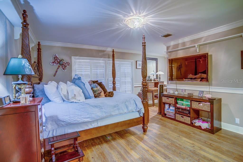 11002 Lake Butler Boulevard Windermere, FL 34786 - Photo 60 of 62 a living room with furniture and a flat screen tv