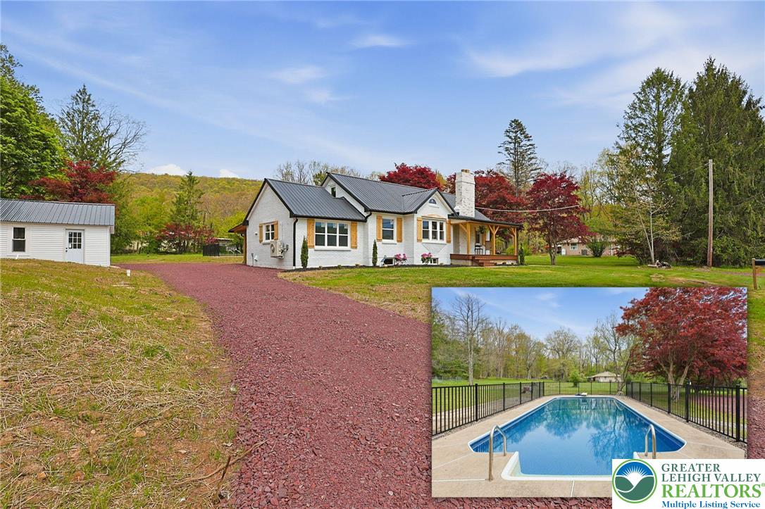 121 Ben Titus Road Tamaqua, PA 18252 - Photo 1 of 48 a view of swimming pool with outdoor seating and city view