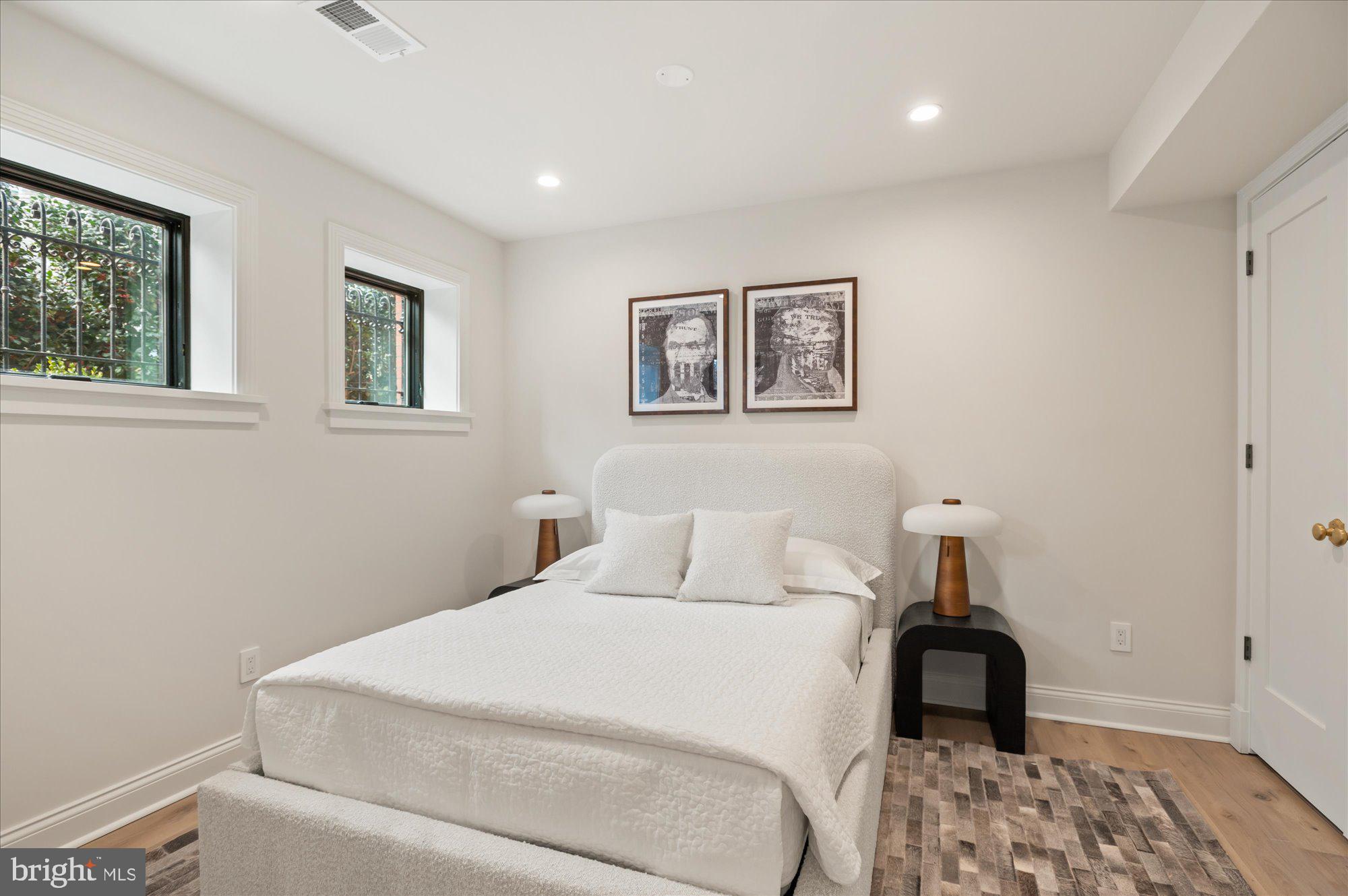 1115 Rhode Island Avenue Northwest Washington, DC 20005 - Photo 76 of 81 a bedroom with a bed and a window