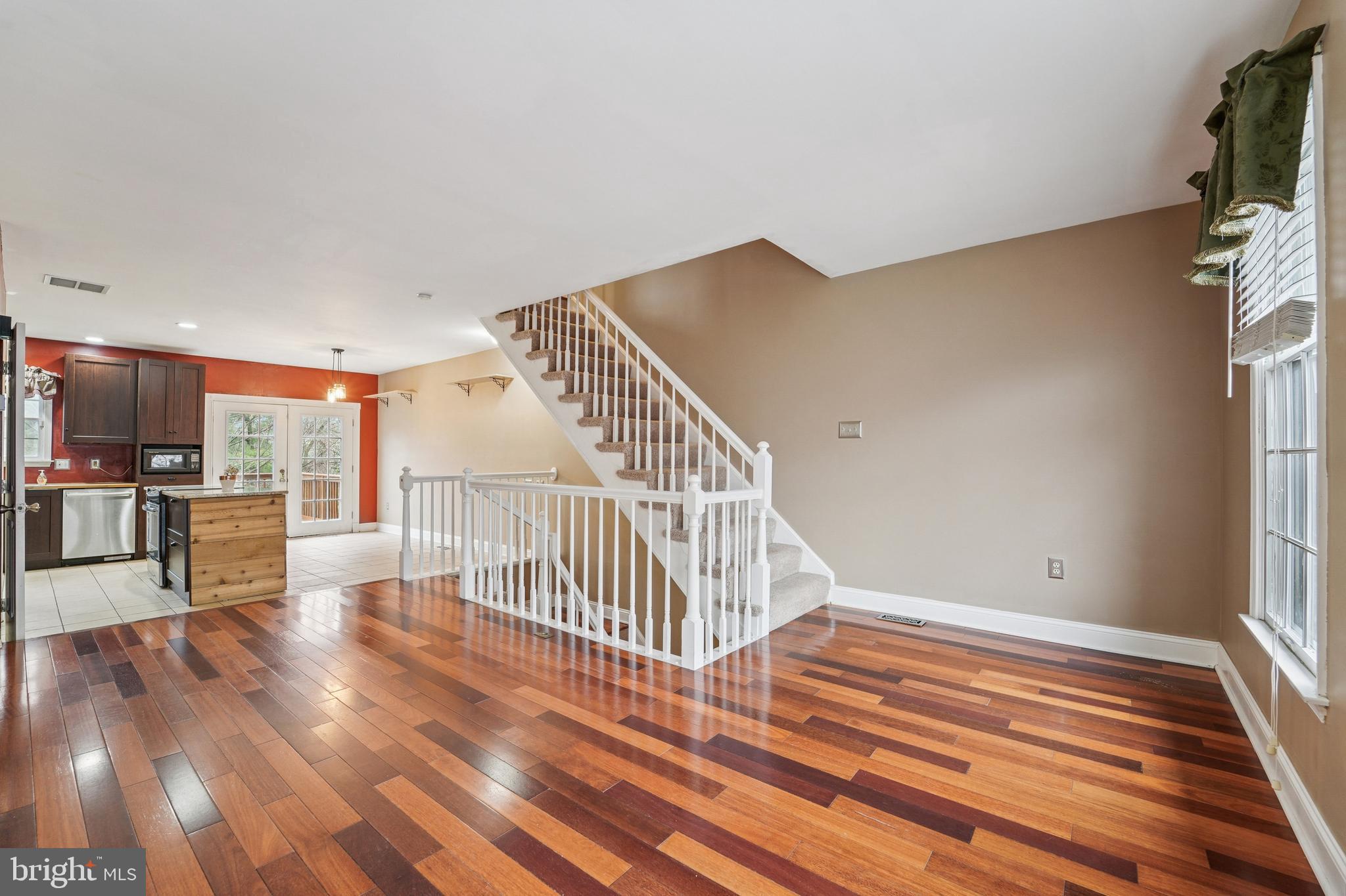 56 Victoria Square Frederick, MD 21702 - Photo 3 of 38 a view of entryway and hall with wooden floor