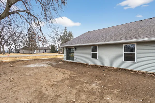 a view of a house with a backyard