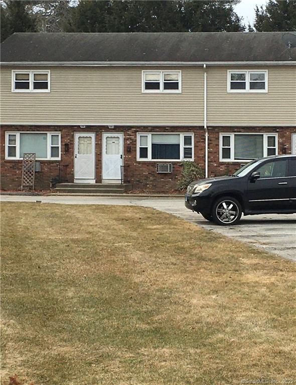 94 Canterbury Road, Unit B Plainfield, CT 06374 - Photo 1 of 1 a front view of a house with a yard