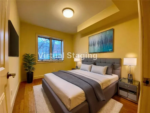 a bedroom with bed and window