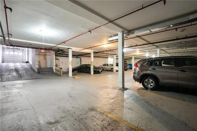 a view of parking garage with cars