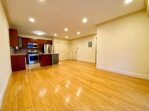 a view of kitchen and kitchen with furniture