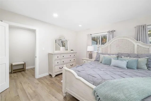 a bedroom with a bed and a cabinets