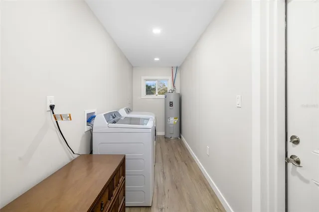 a view of a hallway with furniture