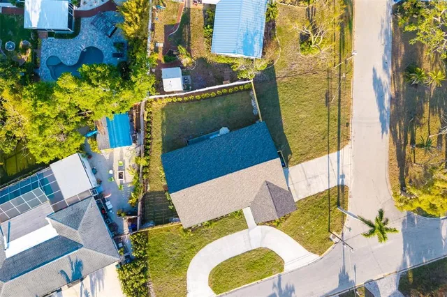 aerial view of a house with swimming pool and porch