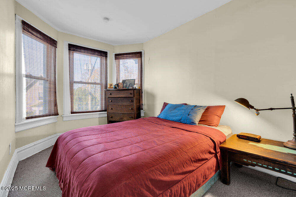 159 Bridge Avenue Red Bank, NJ 07701 - Photo 14 of 39 a bedroom with a bed and a window