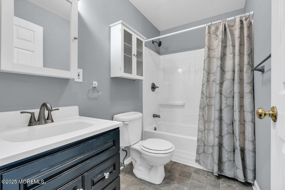 159 Bridge Avenue Red Bank, NJ 07701 - Photo 23 of 39 a bathroom with a sink a toilet and shower