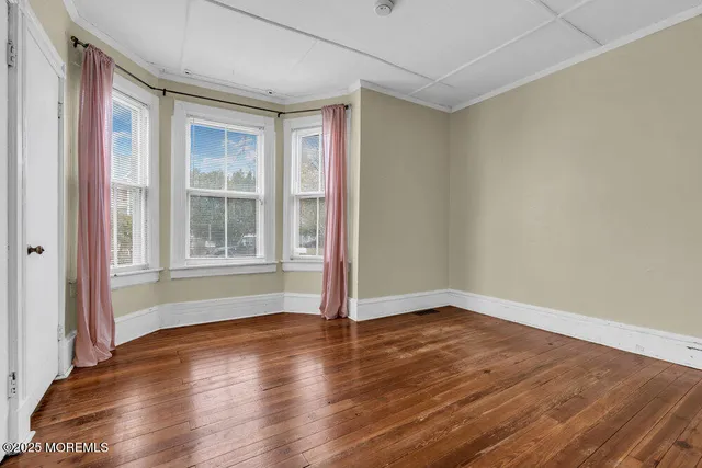 a view of livingroom with hardwood floor and hallway