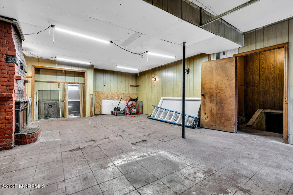 159 Bridge Avenue Red Bank, NJ 07701 - Photo 32 of 39 a spacious bedroom with a bed a table and a mirror