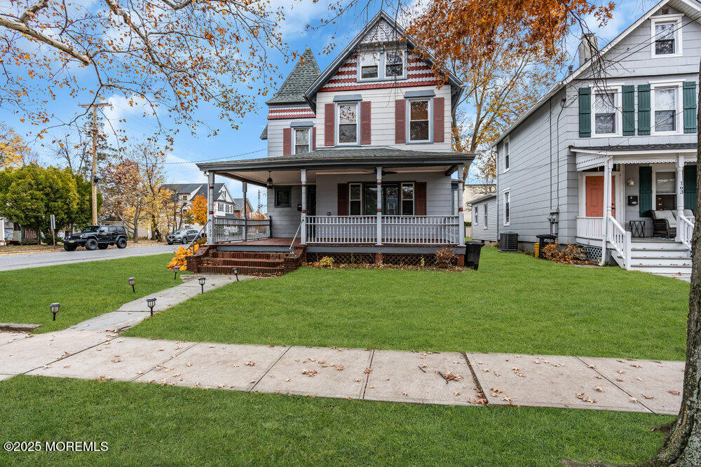 159 Bridge Avenue Red Bank, NJ 07701 - Photo 33 of 39 a front view of a house with a garden and trees
