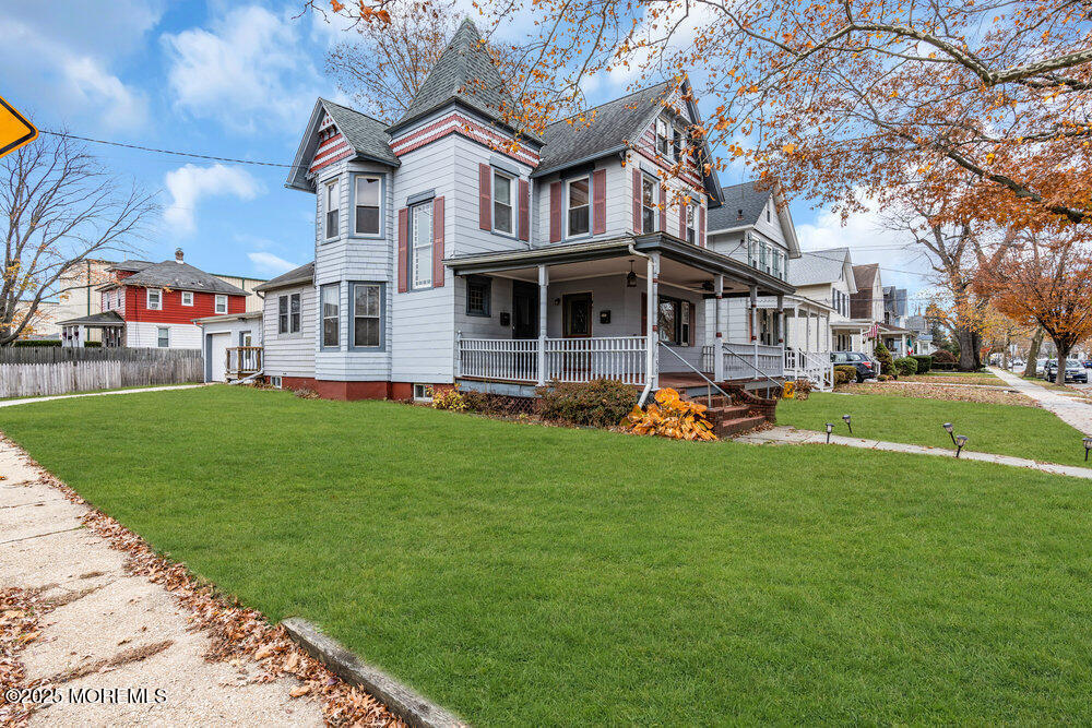 159 Bridge Avenue Red Bank, NJ 07701 - Photo 38 of 39 a front view of a house with a garden and trees