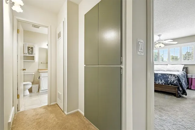 a view of a bedroom with bathroom