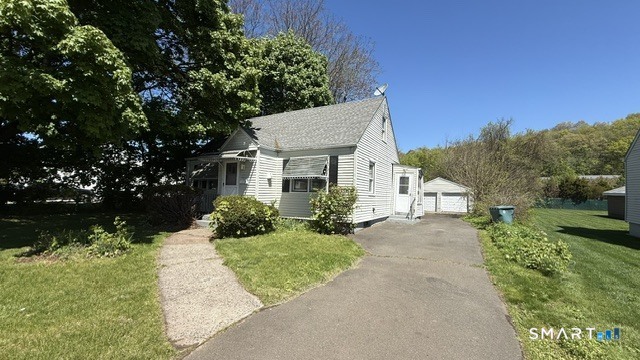 131 Bryden Terrace Hamden, CT 06517 - Photo 1 of 16 front view of a house with a yard