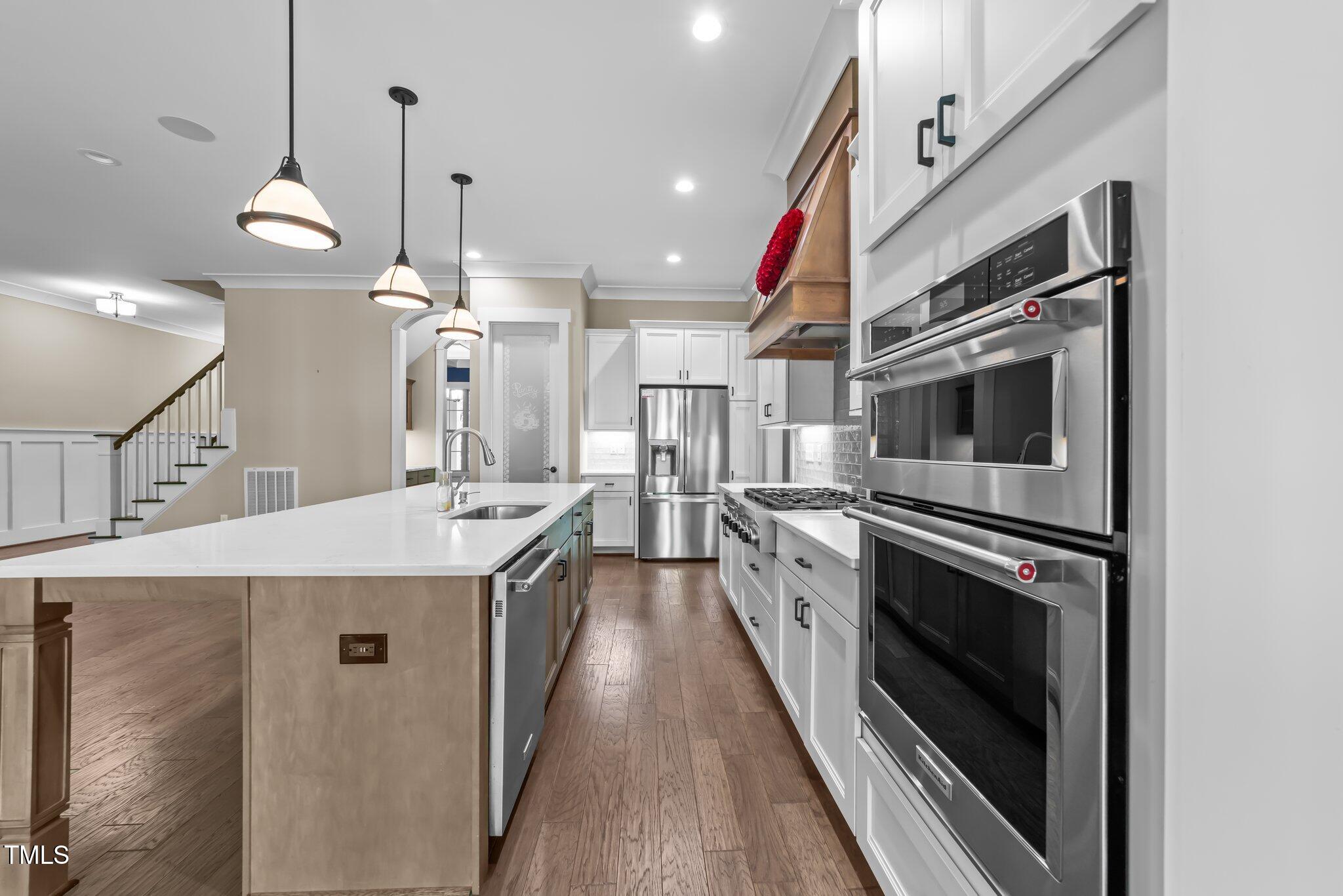 4924 Theys Road Raleigh, NC 27606 - Photo 22 of 74 Modern kitchen with quartz counters