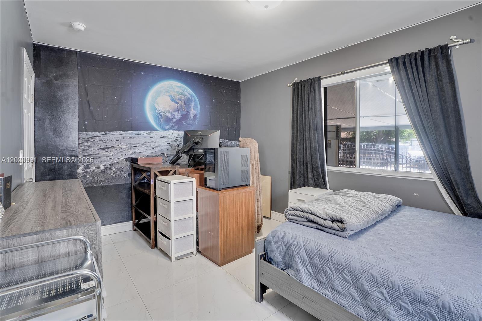 1360 Northwest 77th Street Miami, FL 33147 - Photo 12 of 41 a bedroom with a bed and a large window