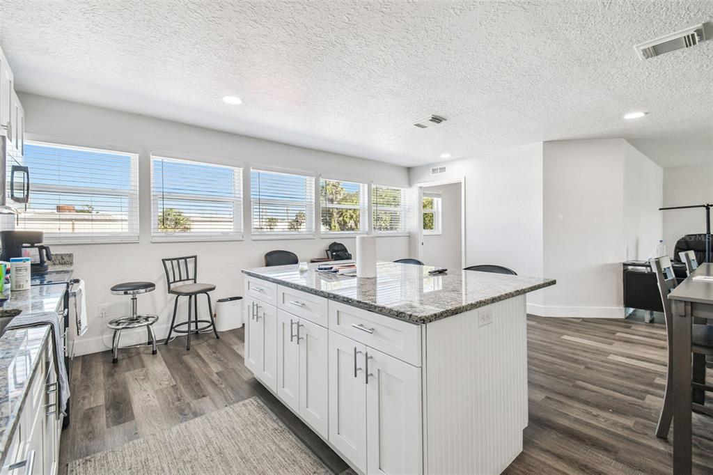 6010 Wall Street Port Richey, FL 34668 - Photo 15 of 43 a kitchen with counter top space and windows